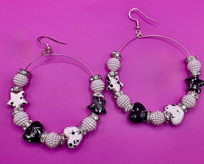 Elegant handmade beaded hoop earrings in black, featuring intricate design and a stylish finish, perfect for enhancing any outfit and suitable for both casual and formal occasions.