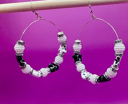 Elegant handmade beaded hoop earrings in black, featuring intricate design and a stylish finish, perfect for enhancing any outfit and suitable for both casual and formal occasions.