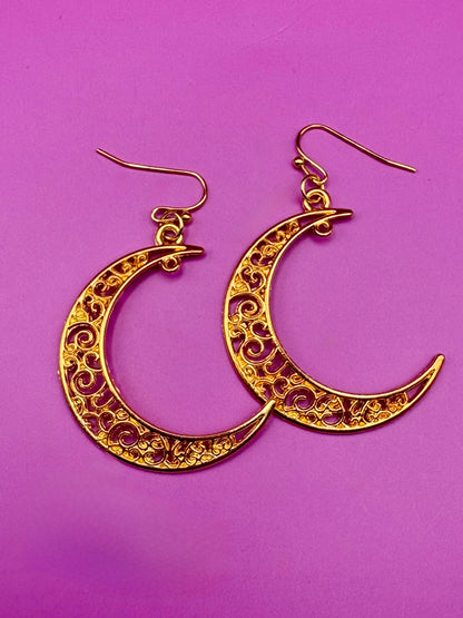 Stylish large moon earrings in gold and silver, perfect for adding a celestial touch to your jewelry collection and complementing any outfit.