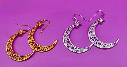 Stylish large moon earrings in gold and silver, perfect for adding a celestial touch to your jewelry collection and complementing any outfit.