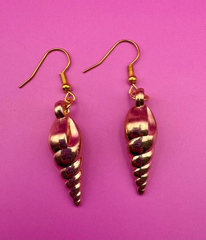 Elegant gold sea shell horn earrings, featuring a unique coastal-inspired design that adds a touch of beachy charm and sophistication to any outfit.