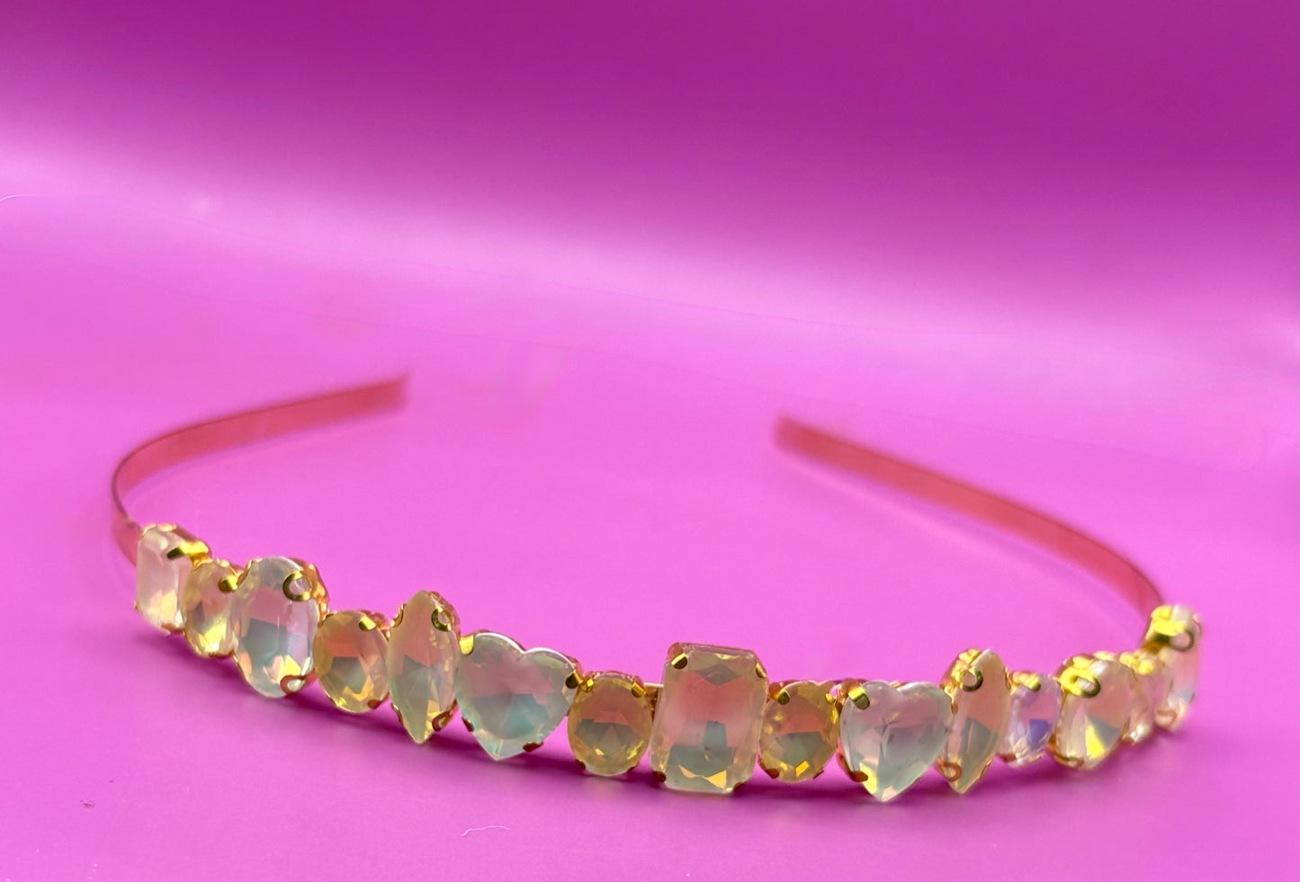 Elegant hand-decorated neon pastel headband featuring sparkling glass rhinestones, perfect for adding a touch of glamour to evening wear and special occasions.