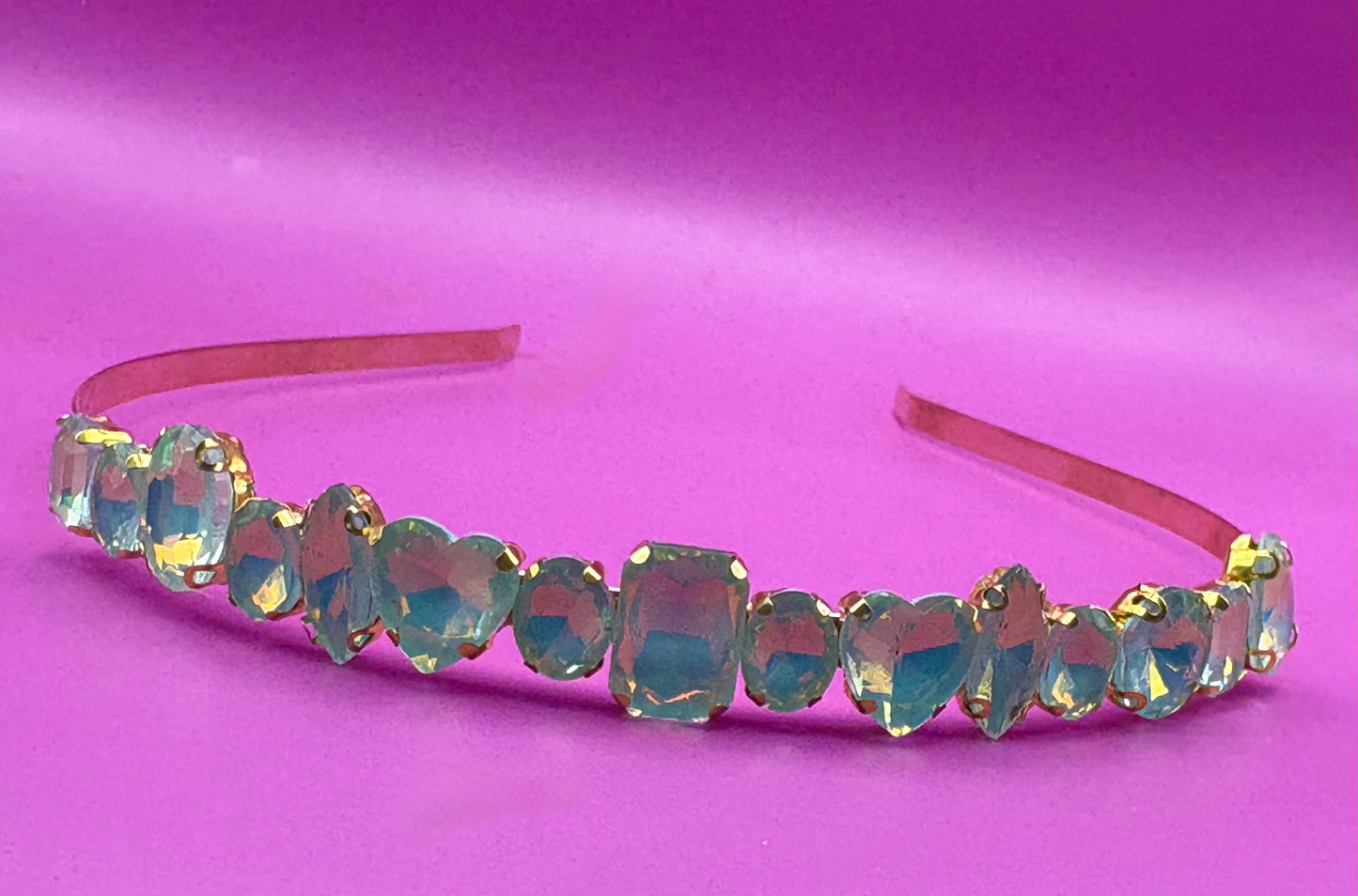 Elegant hand-decorated neon pastel headband featuring sparkling glass rhinestones, perfect for adding a touch of glamour to evening wear and special occasions.