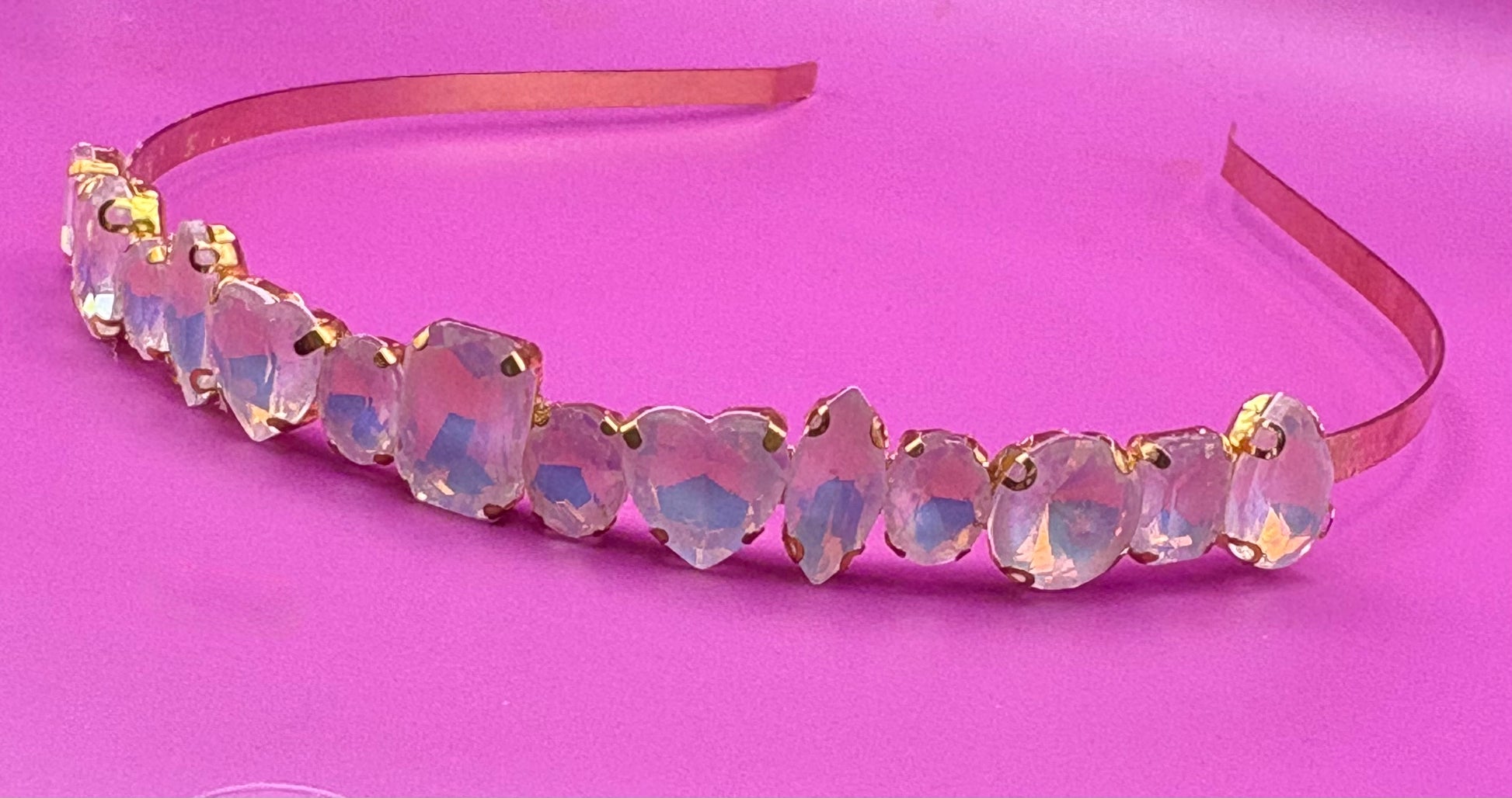 Elegant hand-decorated neon pastel headband featuring sparkling glass rhinestones, perfect for adding a touch of glamour to evening wear and special occasions.