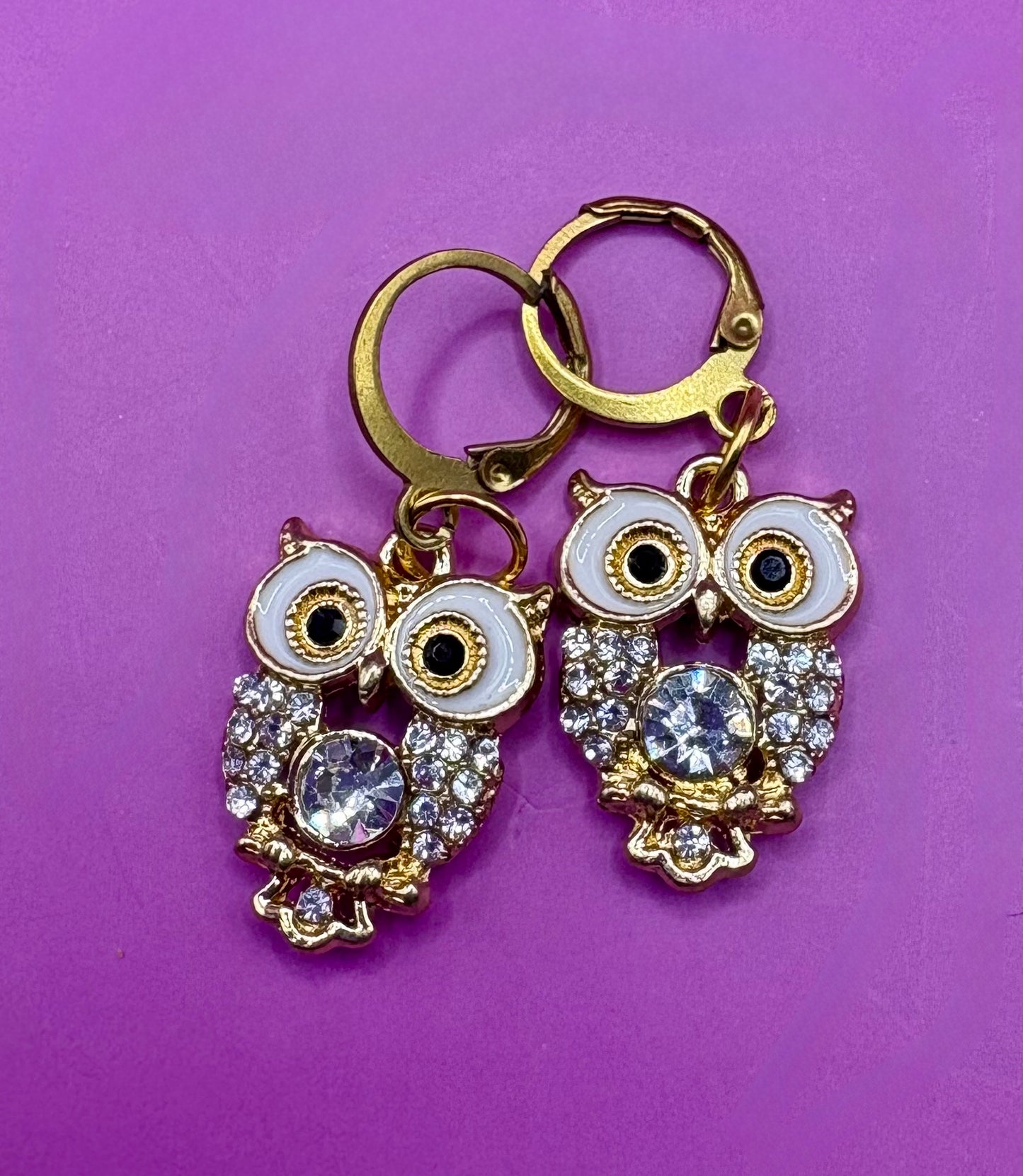 Adorable gold diamante owl earrings featuring sparkling embellishments, perfect for adding a whimsical touch to your jewelry collection and enhancing any outfit.