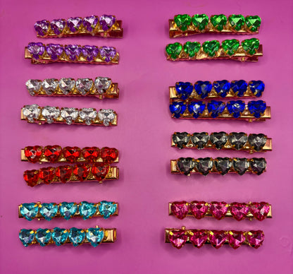 Charming small heart-shaped hair clips  adorned with sparkling rhinestones, ideal for adding a touch of glam to any outfit or as a gift for loved ones.