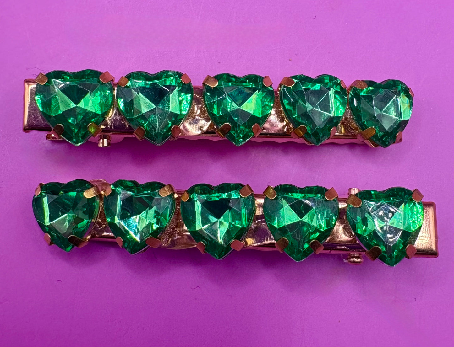 Charming small heart-shaped earrings adorned with sparkling rhinestones, ideal for adding a touch of glam to any outfit or as a gift for loved ones.