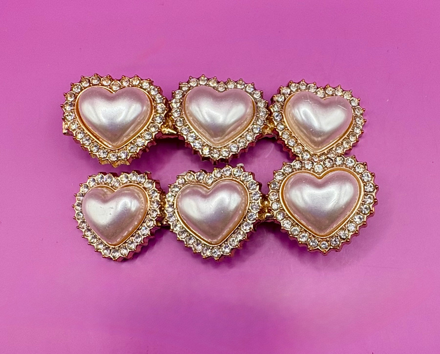 Stylish silver  gold pearlescent hair clip with sparkling pearl accents, perfect for elegant hairstyles and special occasions.