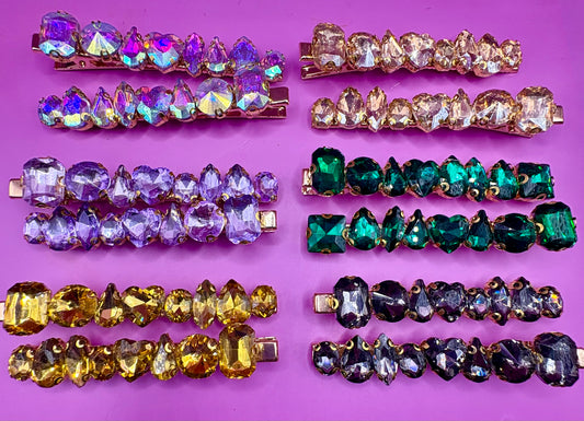 Stylish pair of large gemstone hair slides featuring vibrant colors, perfect for adding a chic and fashionable touch to any hairstyle.