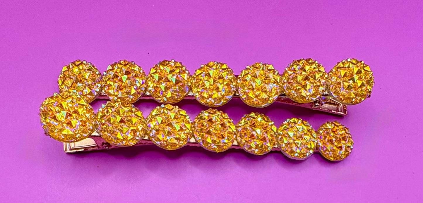Chic large circular glitter heart hair clips, featuring a sparkly design and sold as a pair, ideal for Valentine's Day gifts and enhancing any hairstyle with a touch of glamour. available in multi colour, gold, turquois pink silver purple