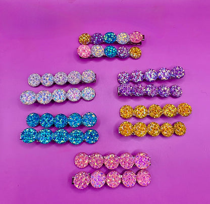 Chic  circular glitter heart hair clips, featuring a sparkly design and sold as a pair, ideal for Valentine's Day gifts and enhancing any hairstyle with a touch of glamour. available in multi colour, gold, turquois pink silver purple