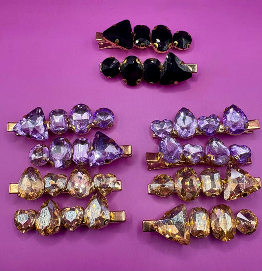 Elegant pair of pink and purple gem stone earrings, featuring a stunning design perfect for adding a pop of color and sophistication to any jewelry collection.