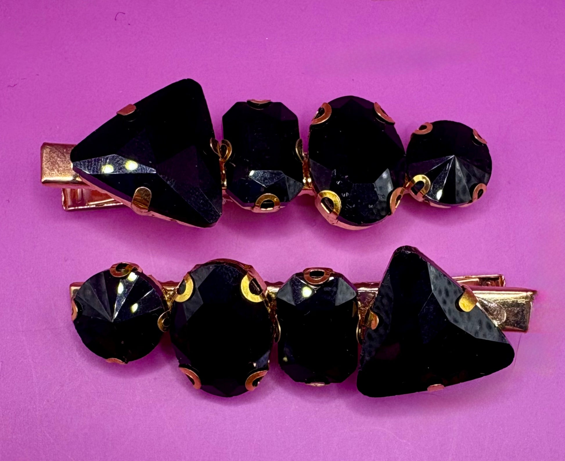 Elegant pair of pink and purple gem stone earrings, featuring a stunning design perfect for adding a pop of color and sophistication to any jewelry collection.