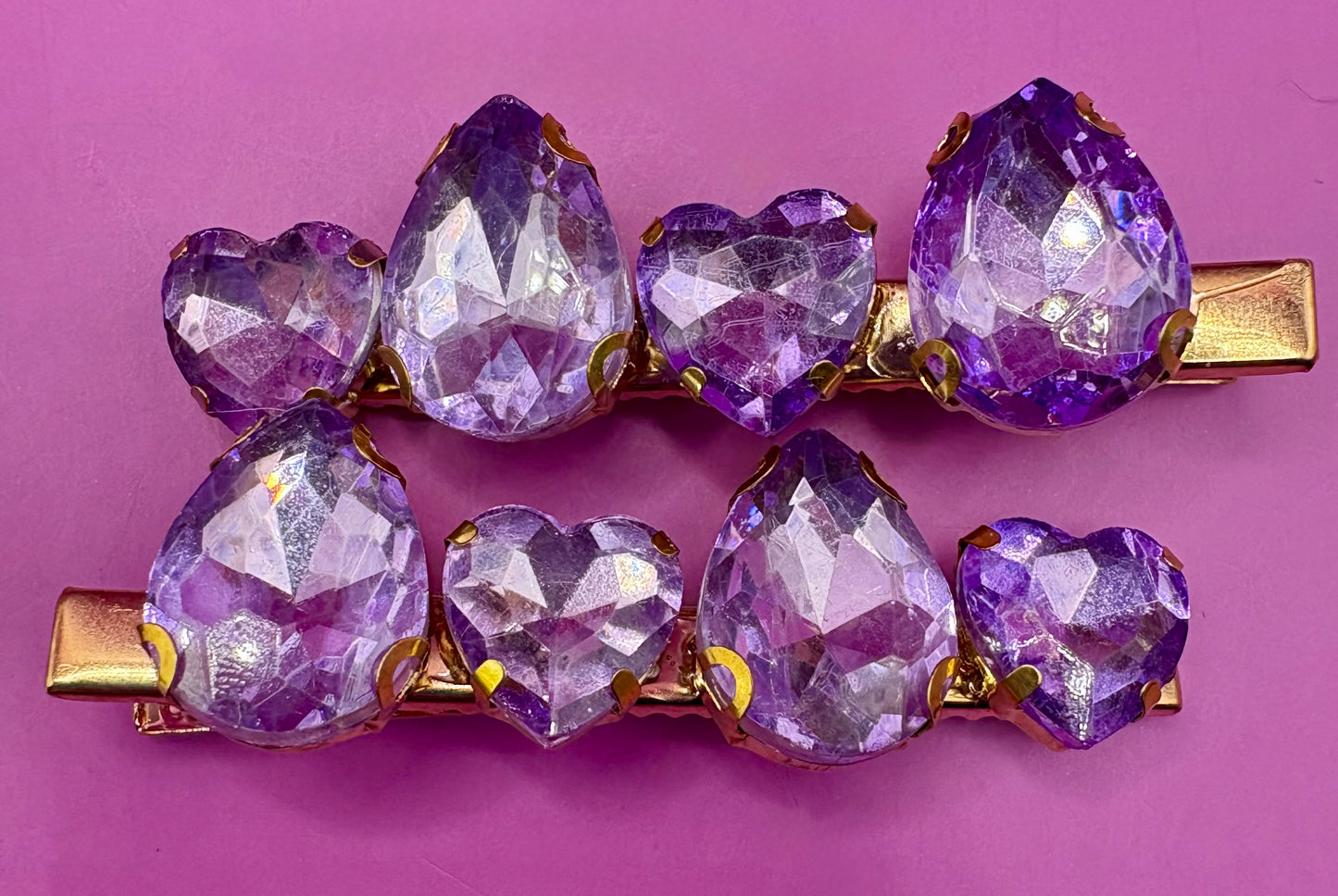 Elegant pair of pink and purple gem stone earrings, featuring a stunning design perfect for adding a pop of color and sophistication to any jewelry collection.