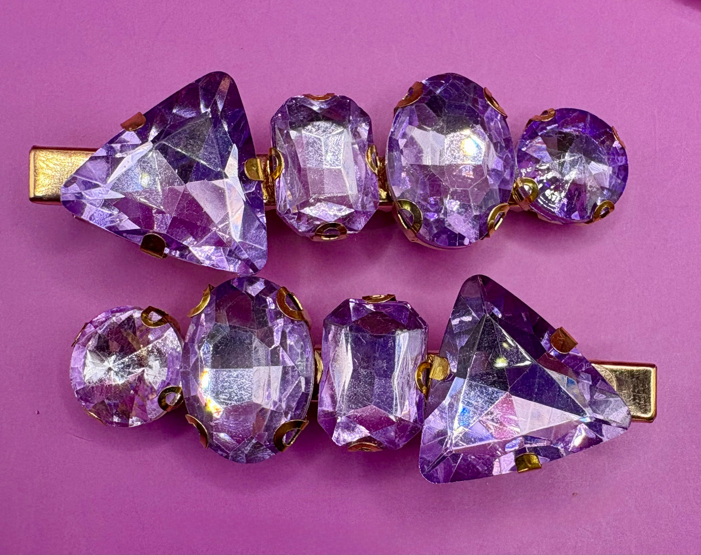 Elegant pair of pink and purple gem stone earrings, featuring a stunning design perfect for adding a pop of color and sophistication to any jewelry collection.