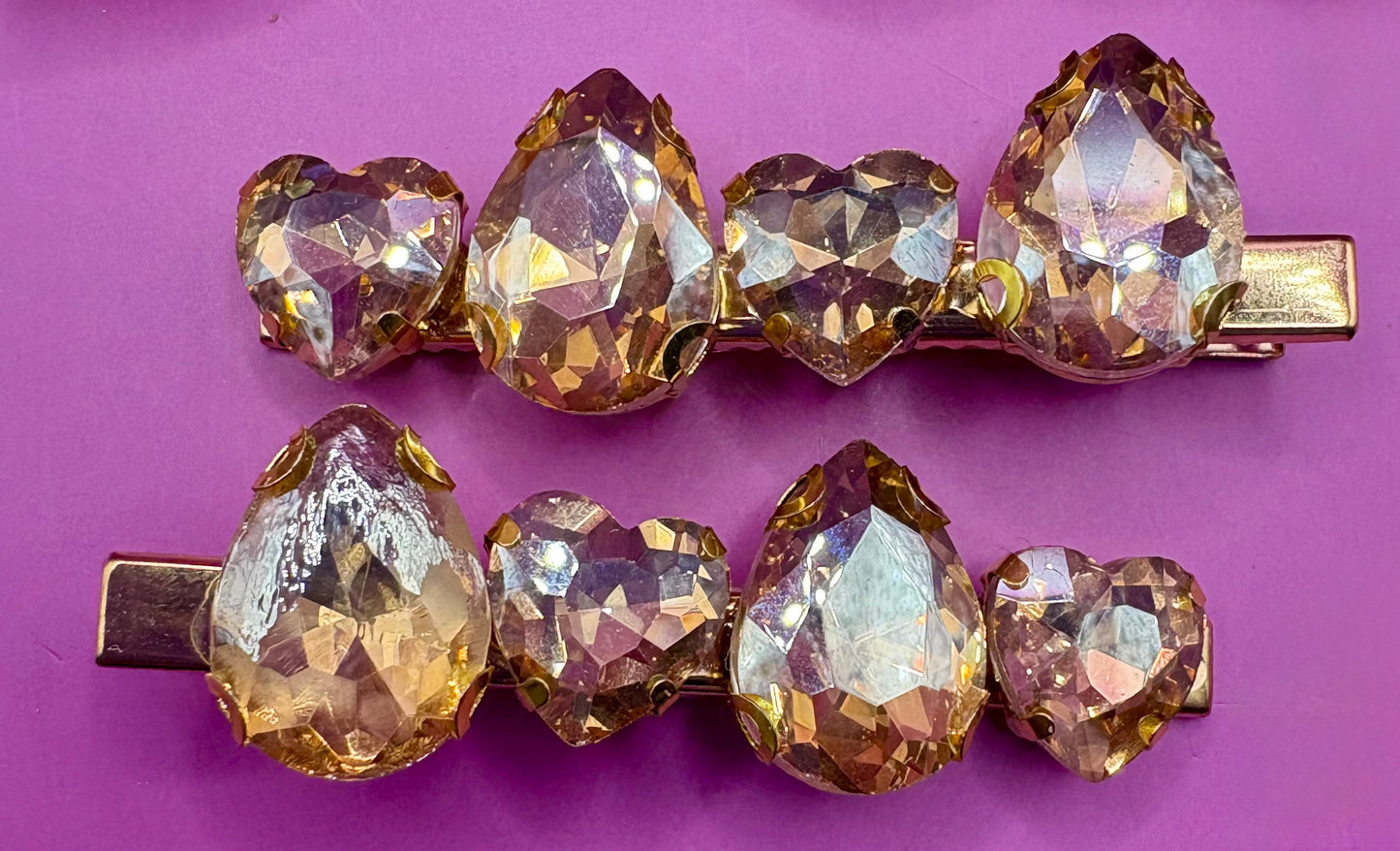 Elegant pair of pink and purple gem stone earrings, featuring a stunning design perfect for adding a pop of color and sophistication to any jewelry collection.