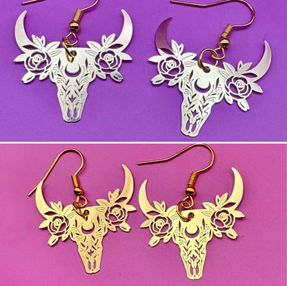 Stylish gold dangly earrings featuring a unique bull design, perfect for animal lovers and adding a bold statement to any outfit