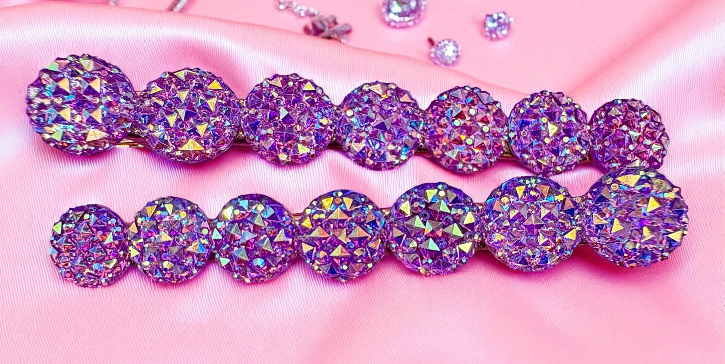 Purple and pink round gemstones hair clips  on a pink background