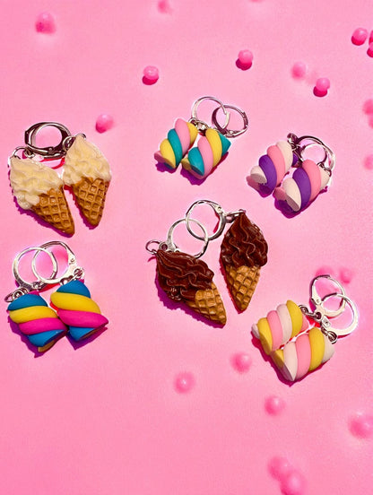 Colorful ice cream-themed earrings on a pink background