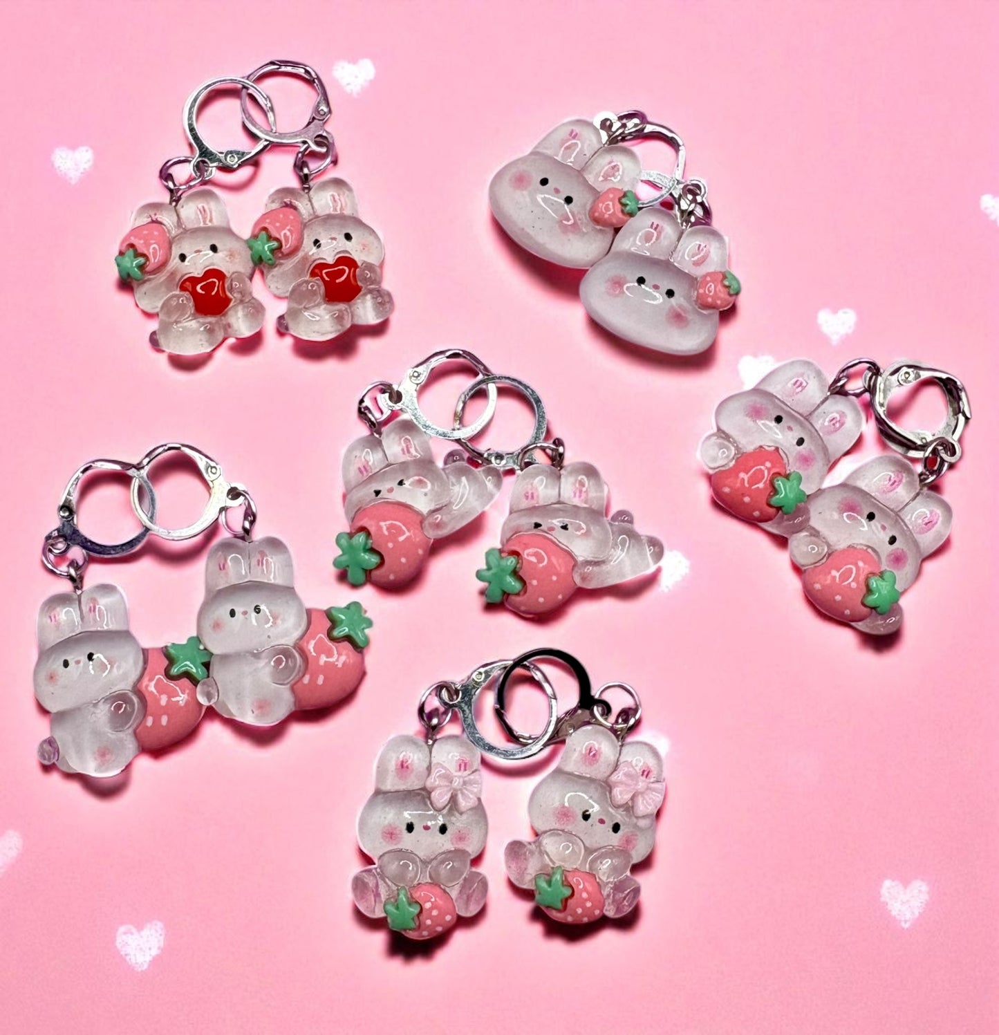 Set of cute keychains with cartoon characters on a pink background