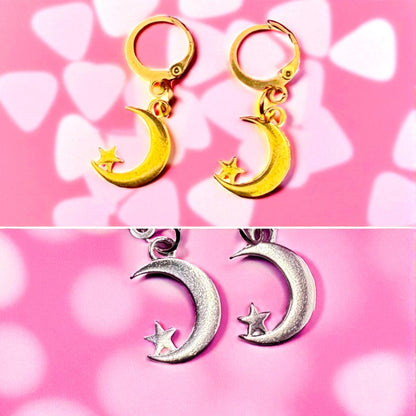 Gold and silver moon-shaped earrings with star details on a pink background