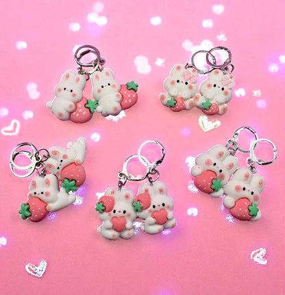 Cute keychains with cartoon characters on a pink background