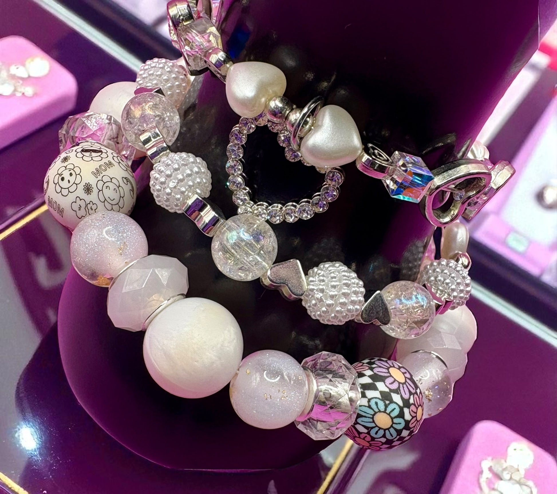 Colorful beaded bracelet on a purple surface