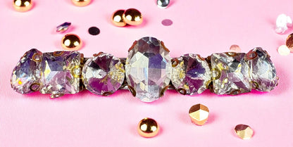 Crystal barrette with rhinestones on a pink background