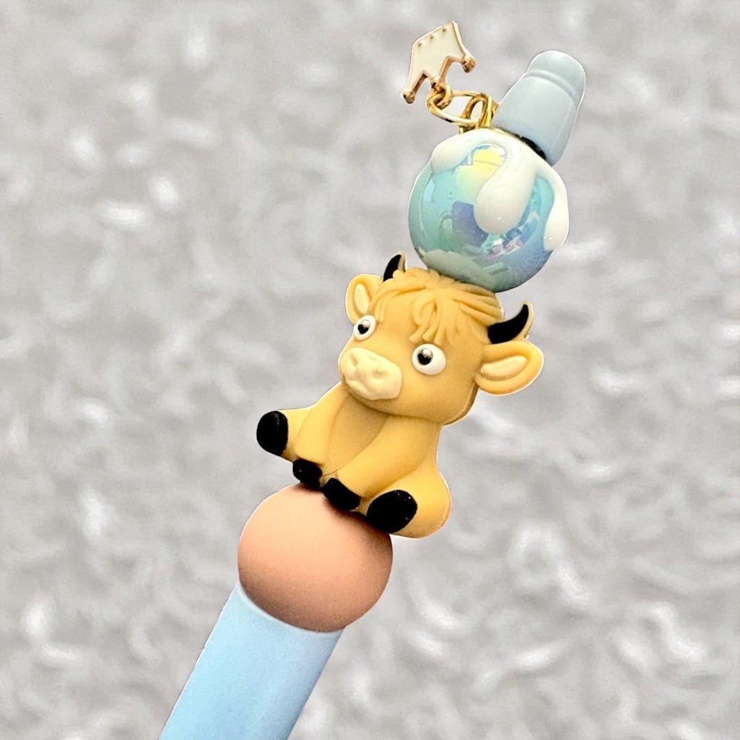Yellow cow figurine with a blue globe on its head against a gray background