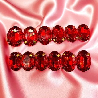 Red gemstone grill on a pink satin background