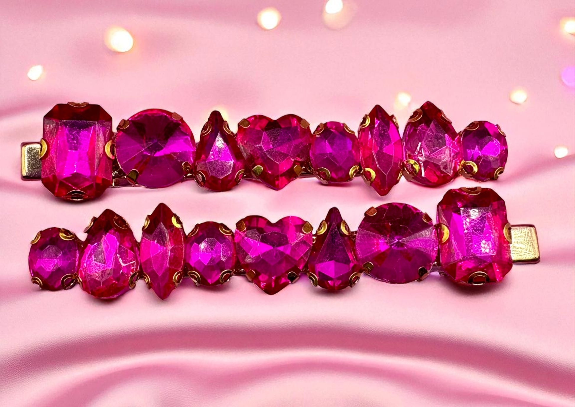 Pink gemstone bracelet on a pink fabric background