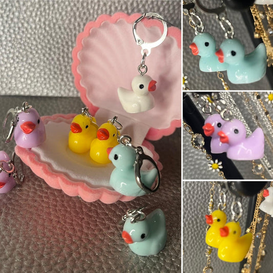 Cute little rubber duck style earrings, dangly drop earrings. available in multiple colours. pink blue yellow purple white costume jewellery