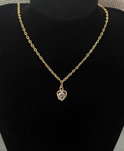 Heart-shaped Cubic Zirconia Pendant Necklace featuring sparkling stones, perfect for adding elegance to any outfit or as a thoughtful gift for loved ones.
