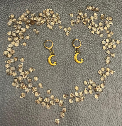 Adorable small moon and star earrings, featuring a charming celestial design perfect for everyday wear, adding a touch of whimsy and sparkle to any outfit