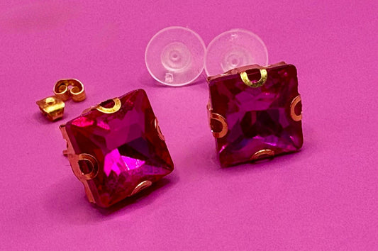 Bold fuchsia square stud earrings, featuring a vibrant color and modern design, perfect for making a statement in any outfit and ideal for both casual and formal occasions.