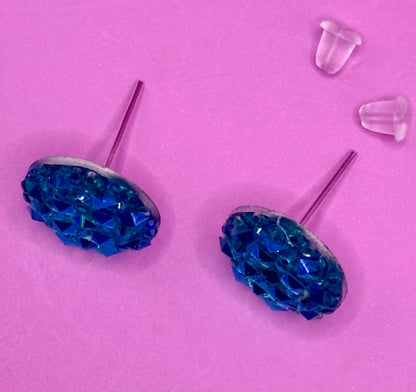 Beautiful dazzling blue stud earrings with sparkling crystals, perfect for adding a pop of color and elegance to any outfit.