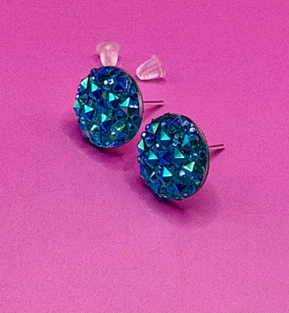 Beautiful dazzling blue stud earrings with sparkling crystals, perfect for adding a pop of color and elegance to any outfit.