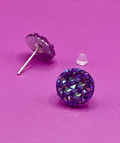 Dazzling purple stud earrings with sparkling gemstones, perfect for adding a touch of elegance to any outfit and enhancing your jewelry collection.