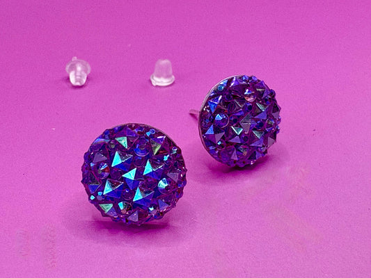 Dazzling purple stud earrings with sparkling gemstones, perfect for adding a touch of elegance to any outfit and enhancing your jewelry collection.