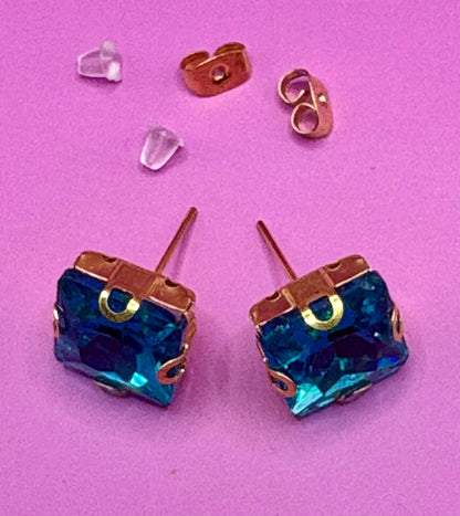 Stunning elegant blue gemstone earrings set in gold, designed for a luxurious look, perfect for special occasions, weddings, or adding sophistication to everyday outfits.