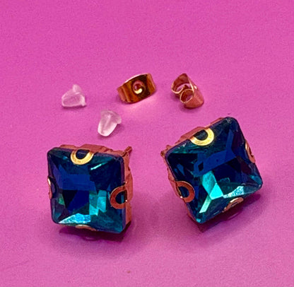 Stunning elegant blue gemstone earrings set in gold, designed for a luxurious look, perfect for special occasions, weddings, or adding sophistication to everyday outfits.