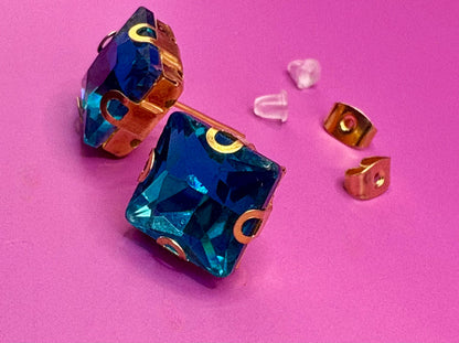 Stunning elegant blue gemstone earrings set in gold, designed for a luxurious look, perfect for special occasions, weddings, or adding sophistication to everyday outfits.