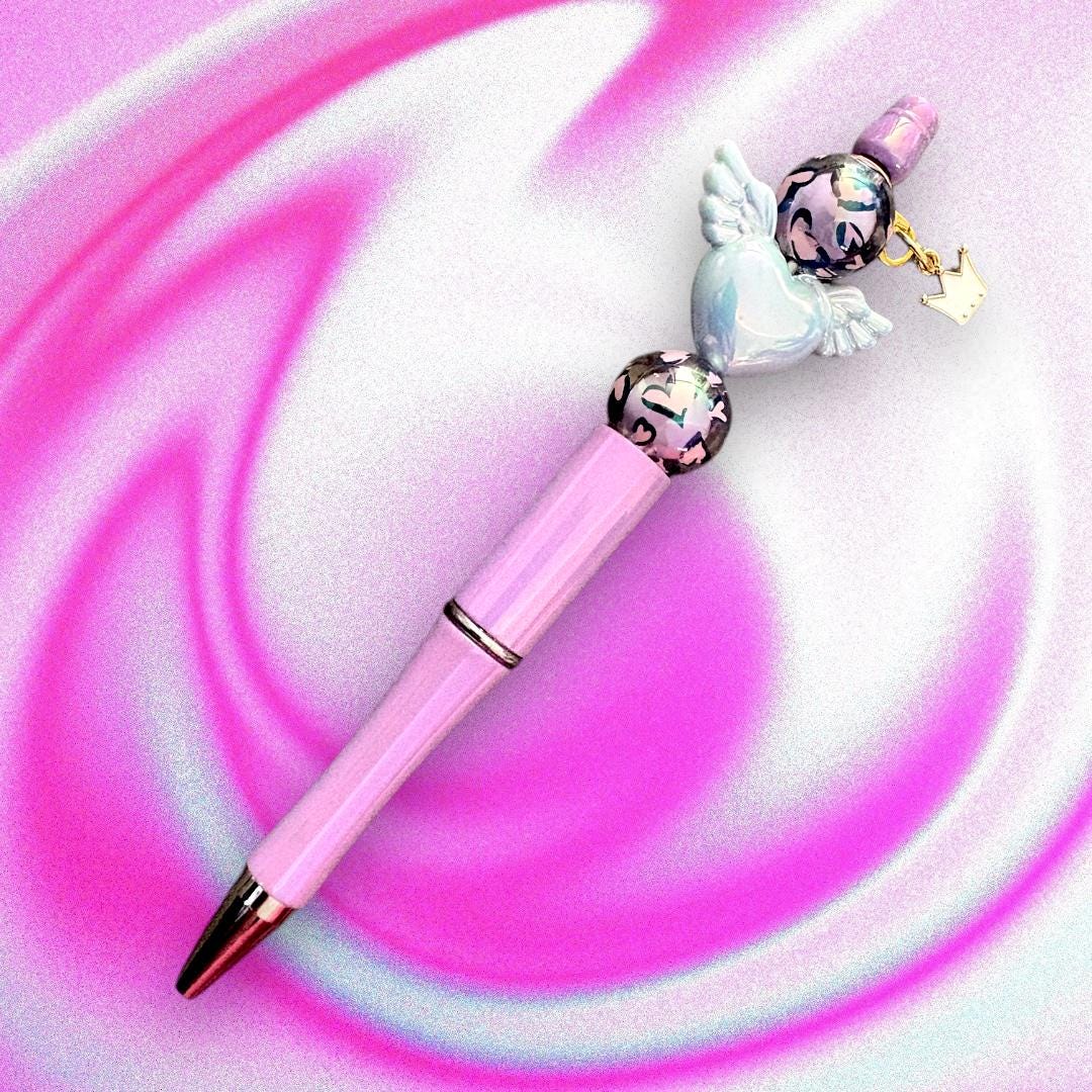 Handcrafted Colourful Black Ballpoint Pens | Unique Beaded Writing Pens | Cute Stationery Gifts for Students & Writers angel wings love
Elevate your writing experience with our enchanting black ballpoint pens, each uniquely designed with delightful heart charms, angel wings and colorful leopard print beads with a cute clover charm!