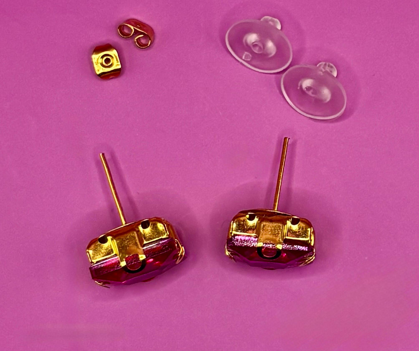 Bold fuchsia square stud earrings, featuring a vibrant color and modern design, perfect for making a statement in any outfit and ideal for both casual and formal occasions.