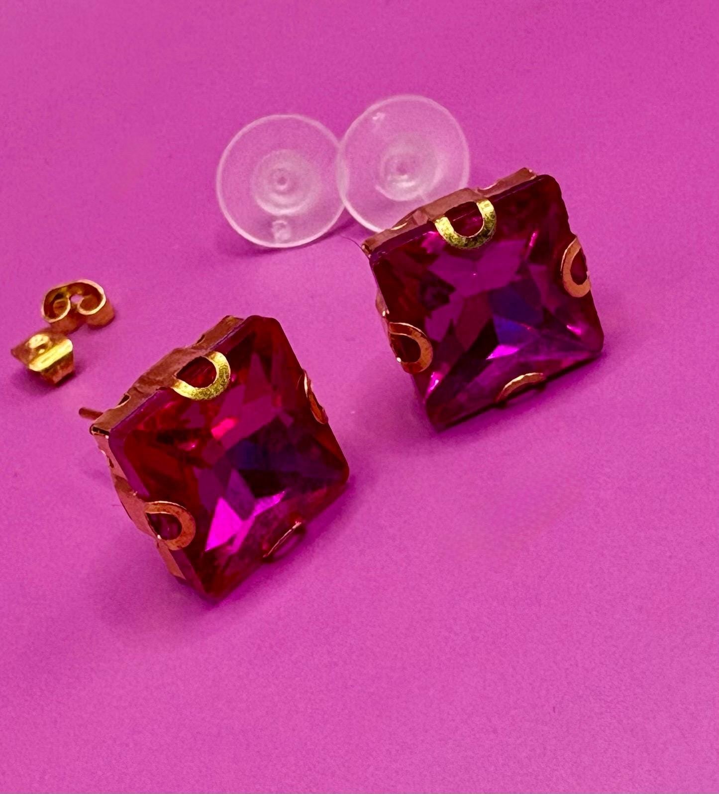 Bold fuchsia square stud earrings, featuring a vibrant color and modern design, perfect for making a statement in any outfit and ideal for both casual and formal occasions.