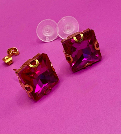Bold fuchsia square stud earrings, featuring a vibrant color and modern design, perfect for making a statement in any outfit and ideal for both casual and formal occasions.