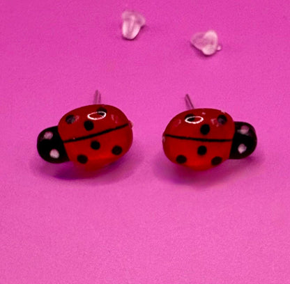 Whimsical red ladybug earrings with charming design, perfect for adding a playful touch to your outfit and ideal for nature lovers and casual wear.