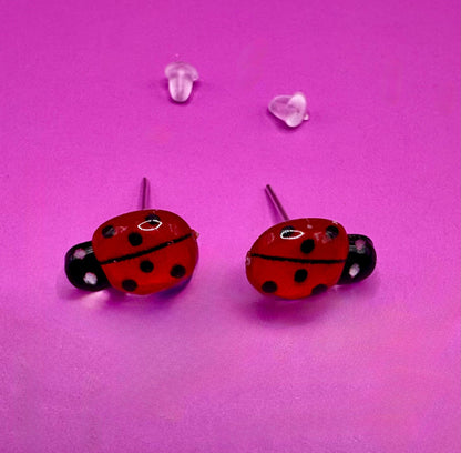 Whimsical red ladybug earrings with charming design, perfect for adding a playful touch to your outfit and ideal for nature lovers and casual wear.