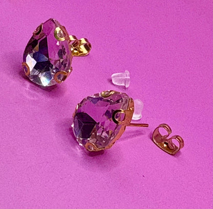 Stunning elegant light pink crystal earrings featuring a delicate design, perfect for special occasions and adding a touch of glamour to any outfit."