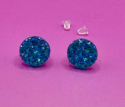 Beautiful dazzling blue stud earrings with sparkling crystals, perfect for adding a pop of color and elegance to any outfit.